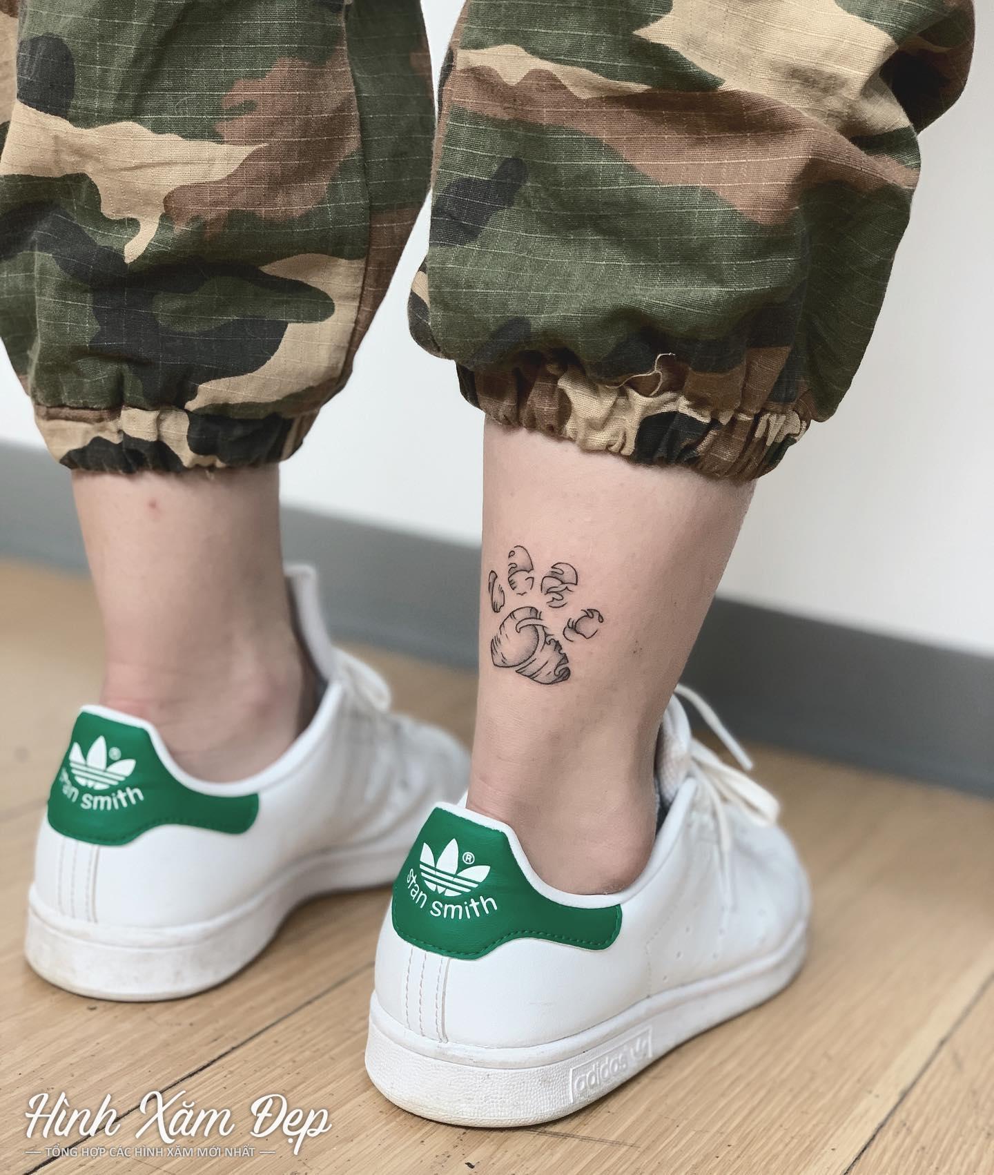 Hình xăm bàn chân cún mini cổ chân
