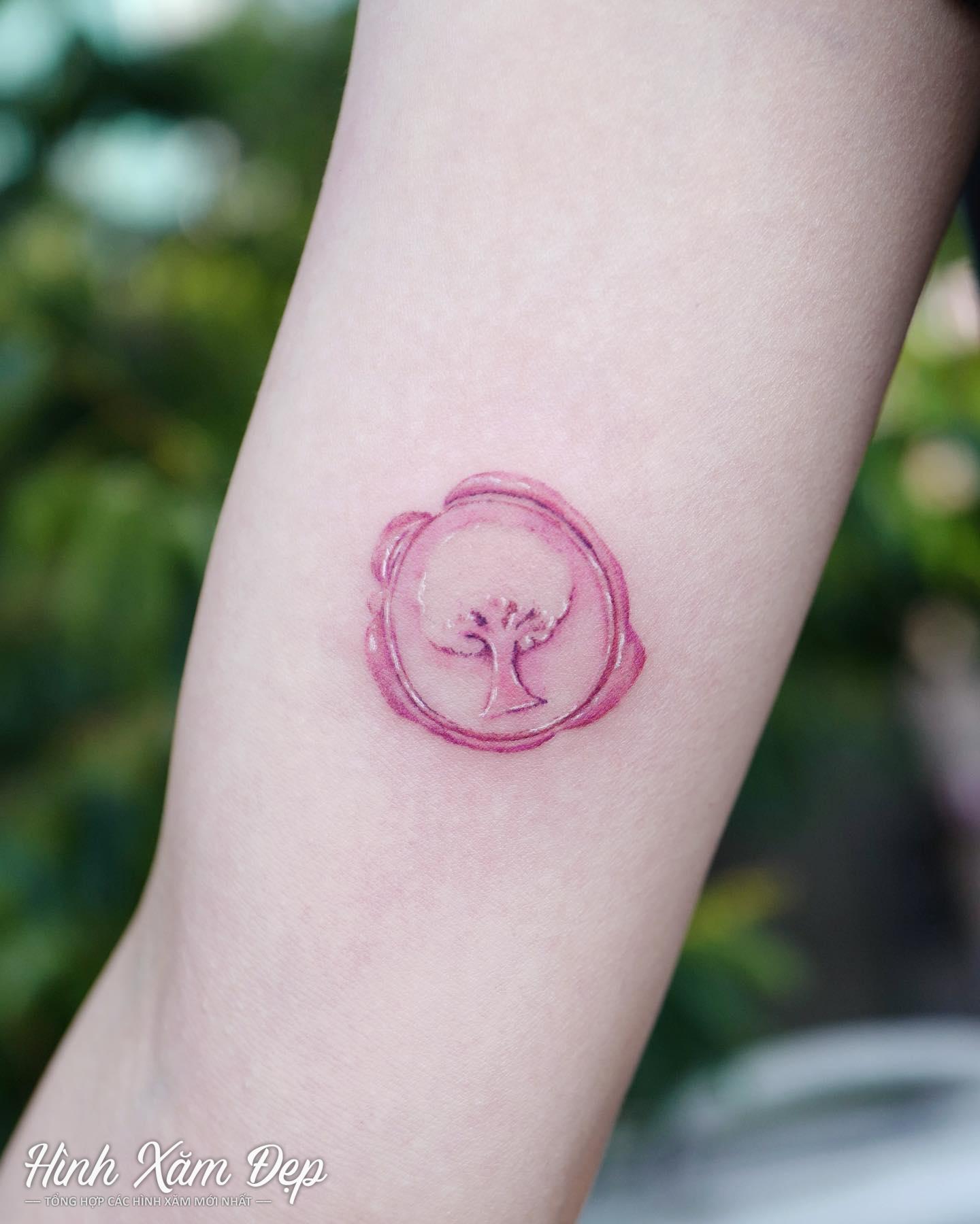 Hình xăm logo mini bắp tay
