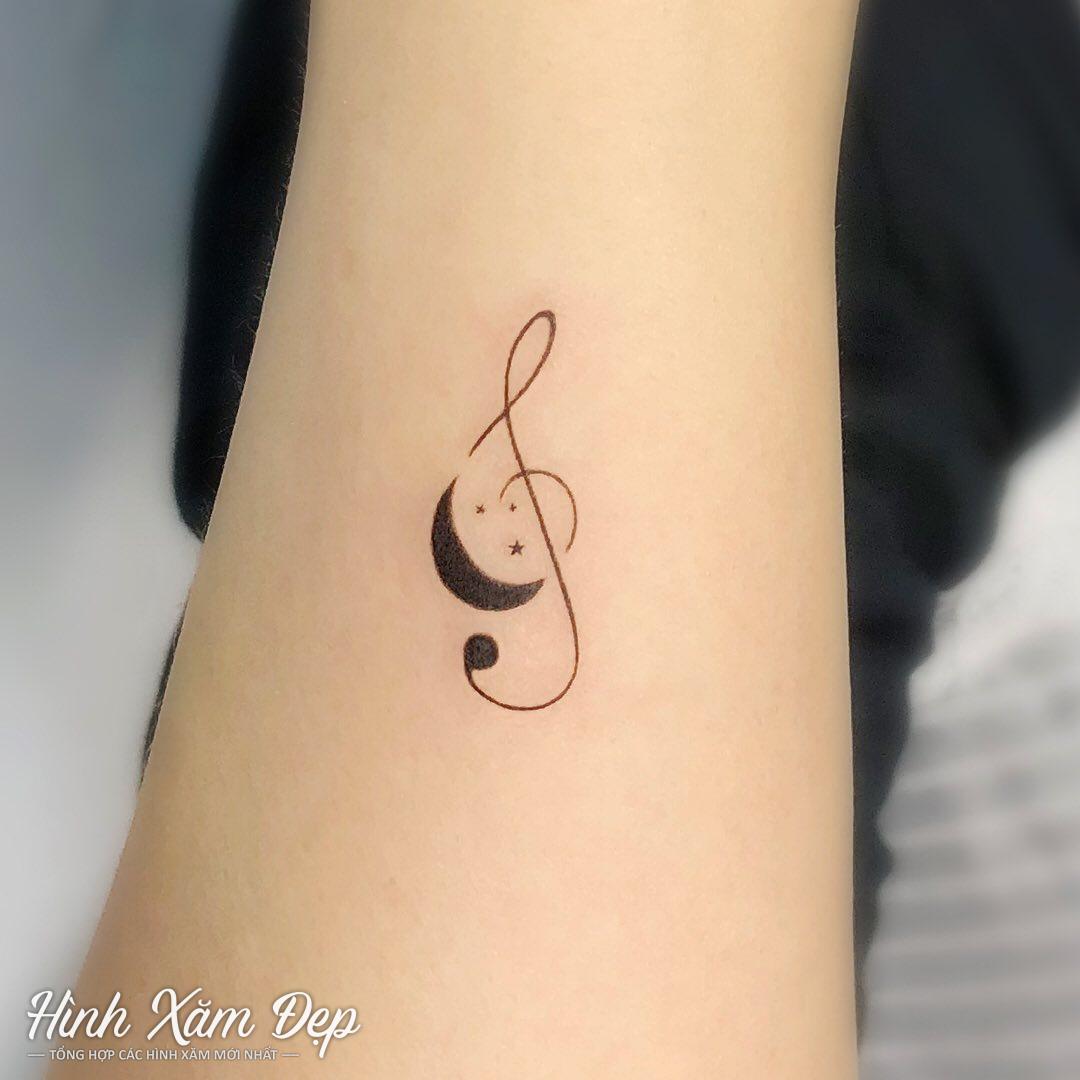 Hình xăm nốt nhạc ở cánh tay